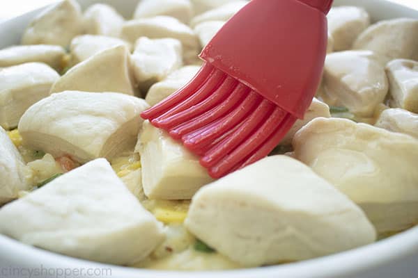 Brushing butter on biscuits