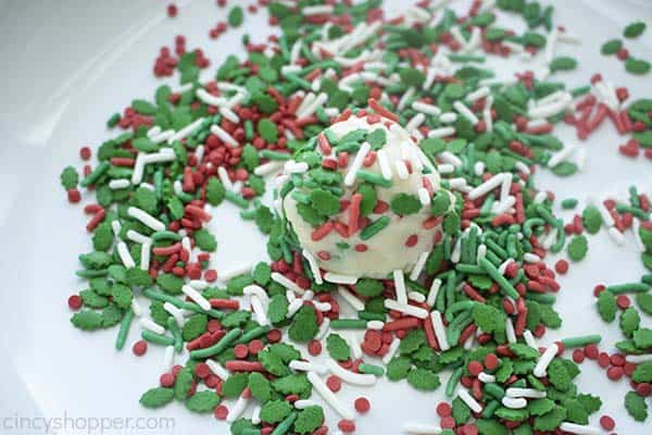 Rolling cookie dough in sprinkles for Christmas