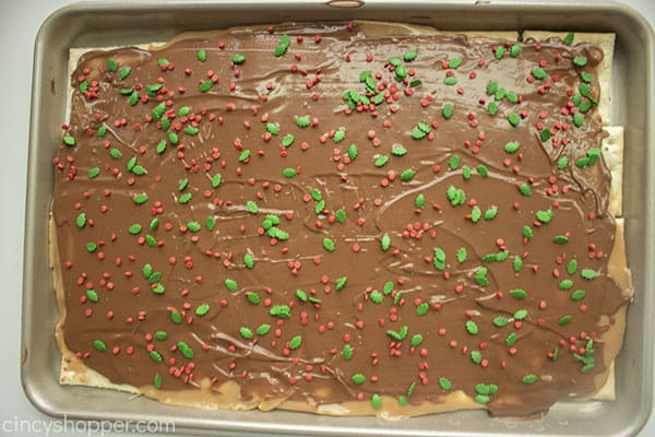 Christmas sprinkles added to crack toffee