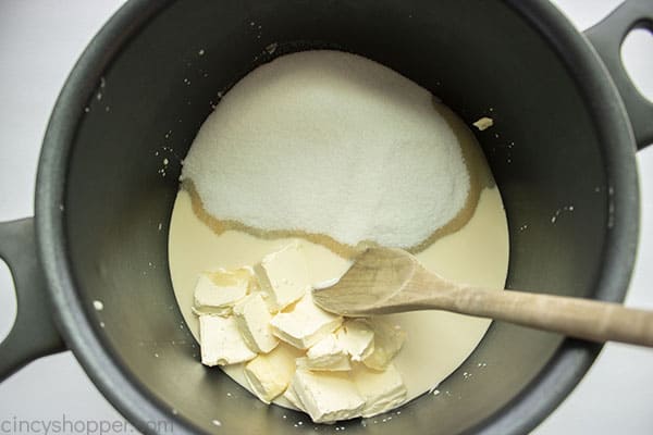 Sugar, margarine and milk in pot
