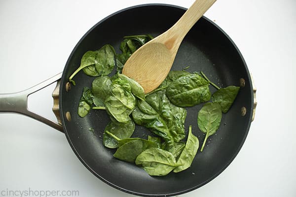 Cooking spinach in a pan