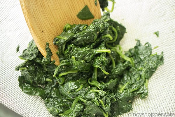 Straining removing moisture from spinach