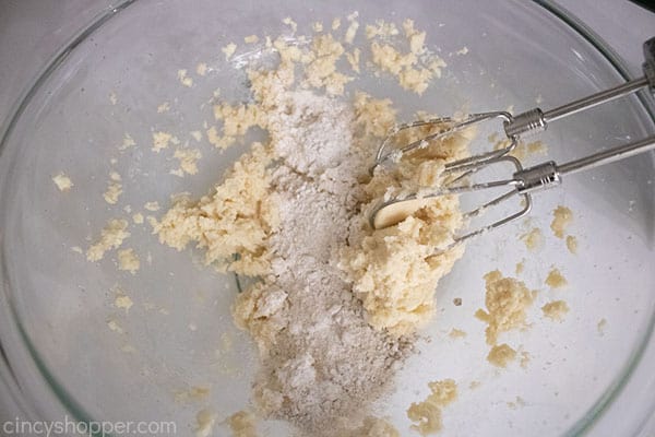 Slowly adding dry ingredients to butter mixture