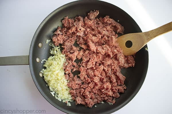 Ground beef added to pan
