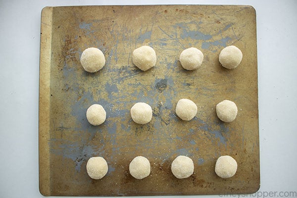 Cookie dough balls on cookie sheet