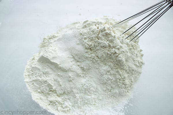 Dry ingredients in a bowl with whisk