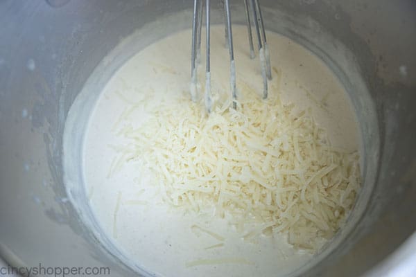 Adding cheese to roux sauce