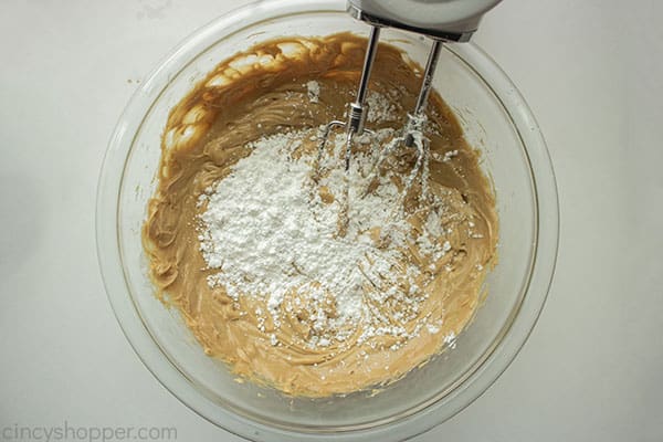 Adding sugar to peanut butter mixture