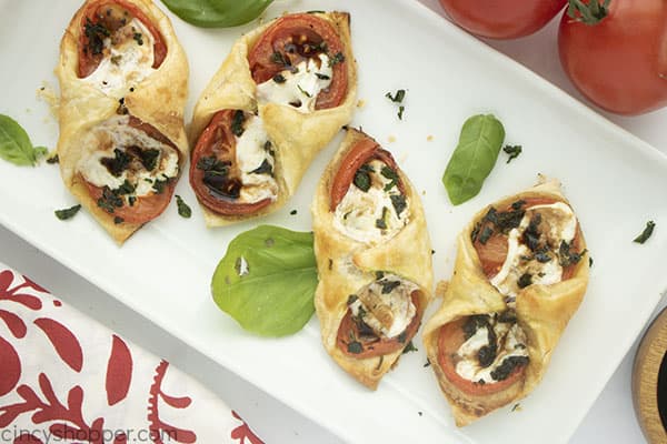 Caprese appetizers made with pastry on platter