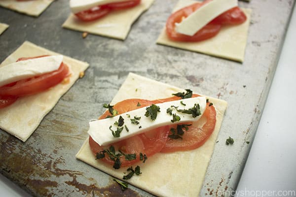 Fresh basil added on the top of cheese