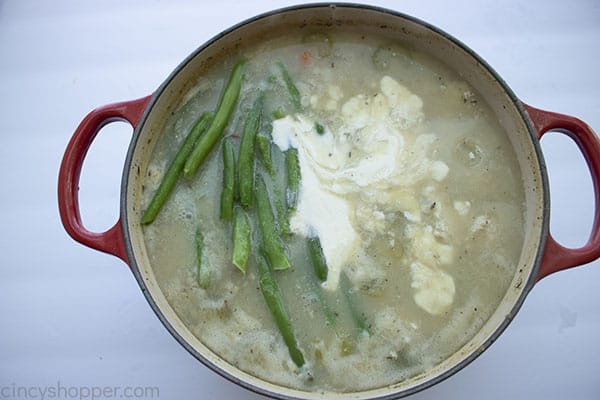 Cream and green beans added to stew