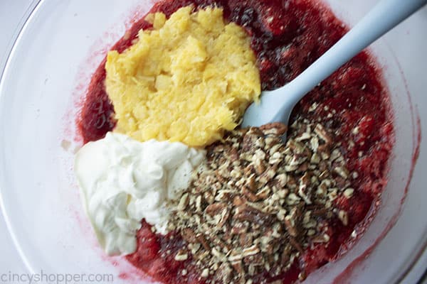 Pineapple, nuts and sour cream added to cranberry Jell-O mixture