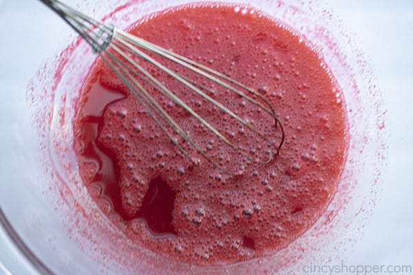 Jello mixed in a bowl with whisk