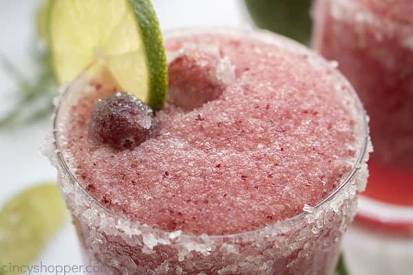 Cranberry Margaritas with sugared cranberries and lime