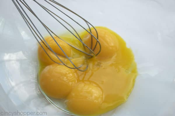 whisking eggs in a bowl