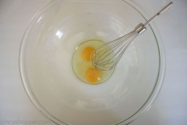 Eggs in a bowl with whisk