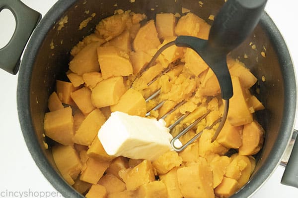 Adding butter to sweet potatoes