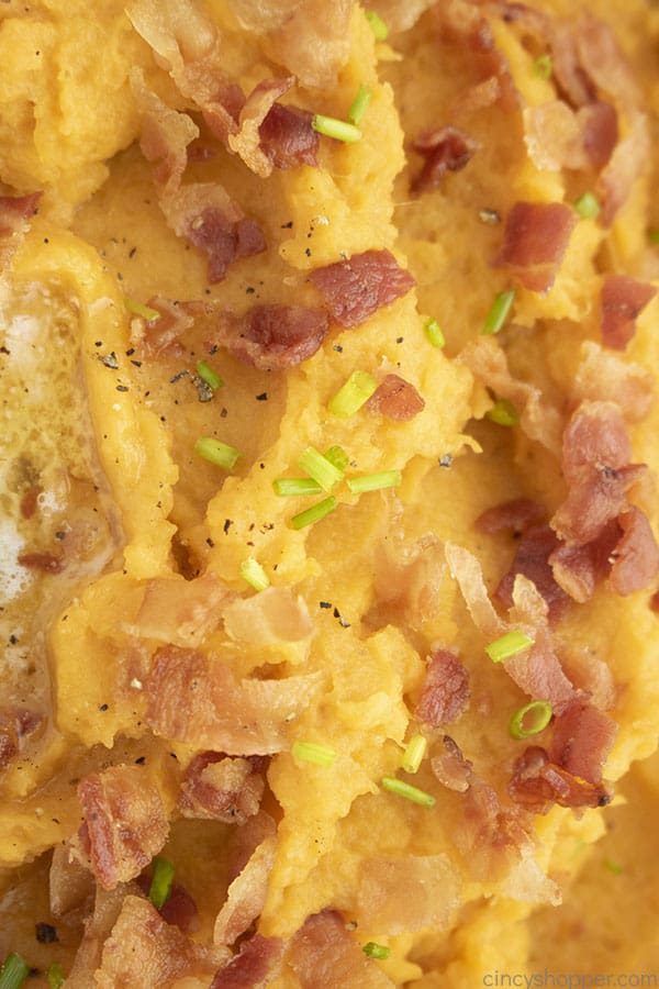 Closeup of mashed sweet potatoes with bacon
