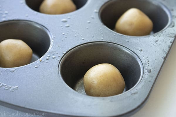 Peanut butter cookie dough in mini muffin tin