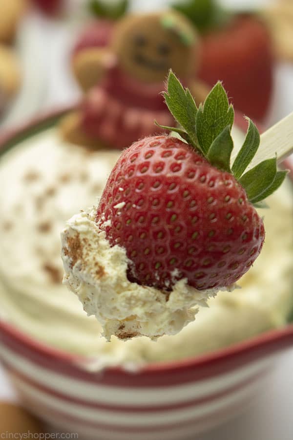 Eggnog dessert dip on a strawberry