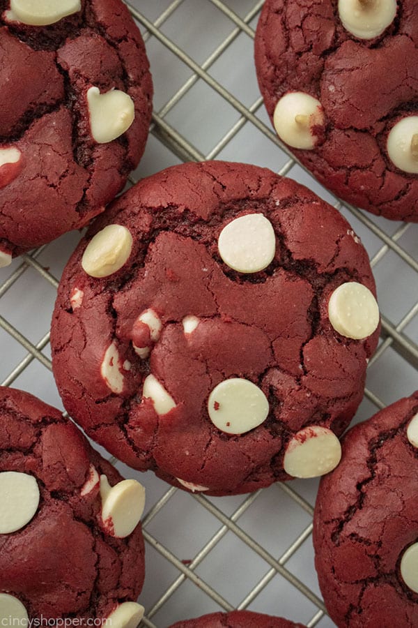 Red Velvet Cake Mix Cookies with chocolate chips on a rack