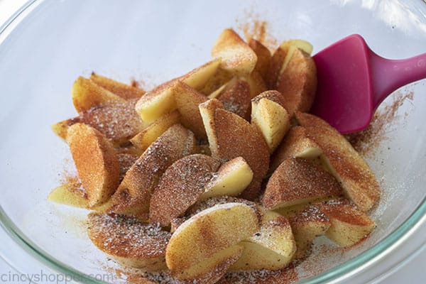 Seasonings added to potatoes in a bowl