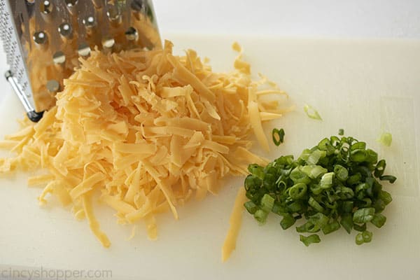 Shredded cheese and chopped chives for bread recipe