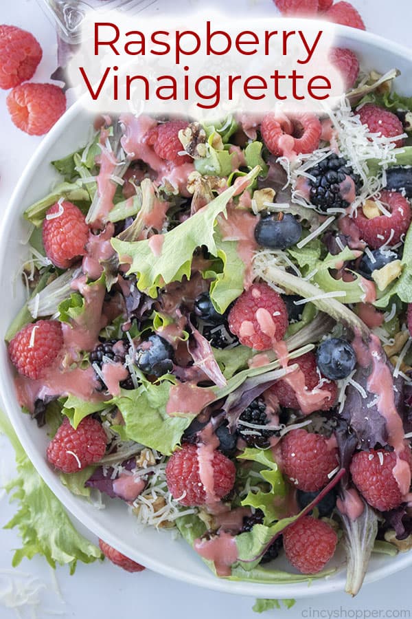 Text on image of berry salad Raspberry Vinaigrette 