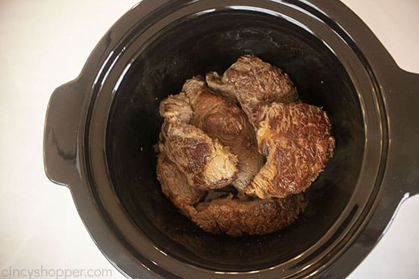 Chuck roast added to crockpot for beef barbacoa