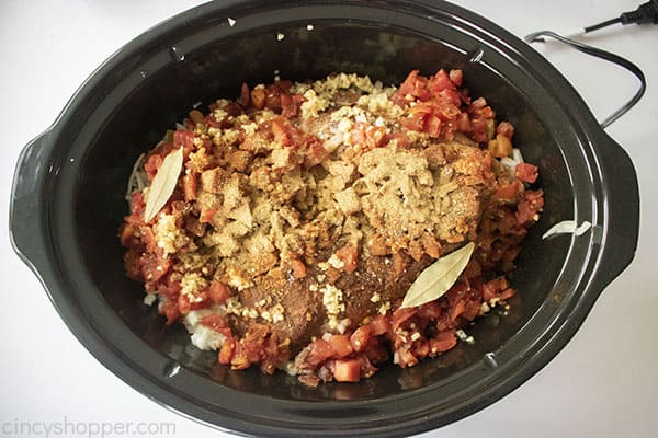 All CopyCat Chipotle Carnitas ingredients in slow cooker
