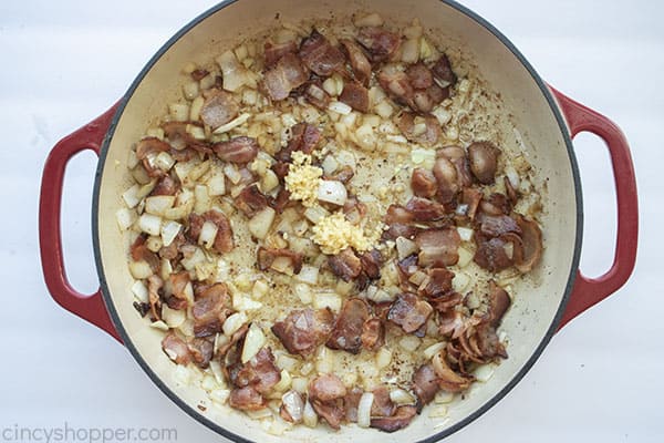 Garlic added to bacon and onions