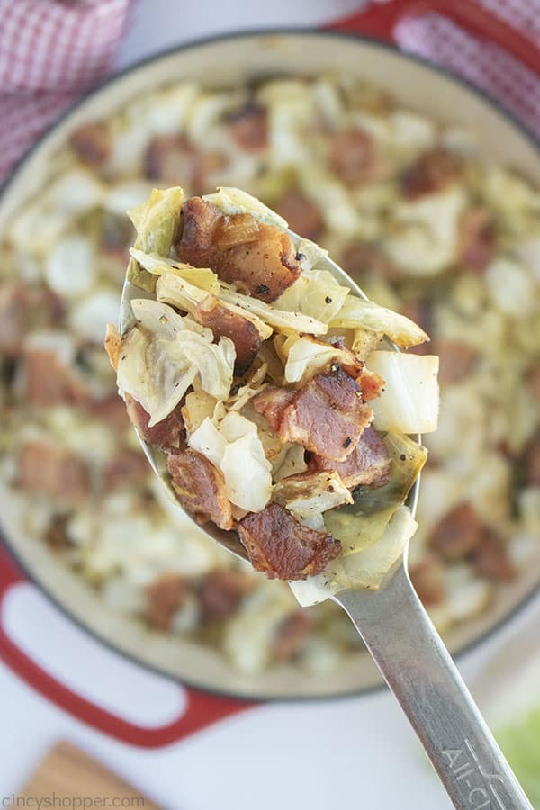 Fried Cabbage with bacon on a spoon