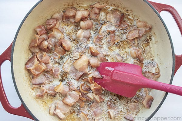 Fried bacon pieces in a pan