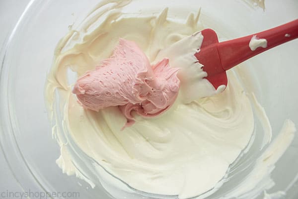 Strawberry frosting added to white chocolate