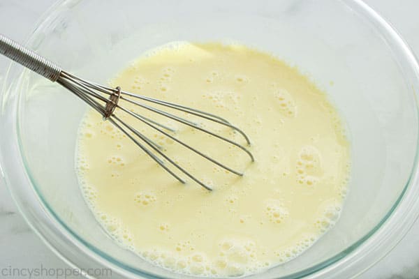 Banana Pudding mixture in bowl with wisk