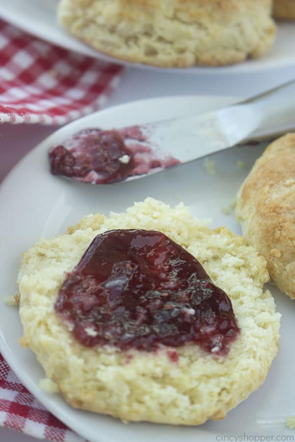 Jam on opened homemade buttermilk biscuit