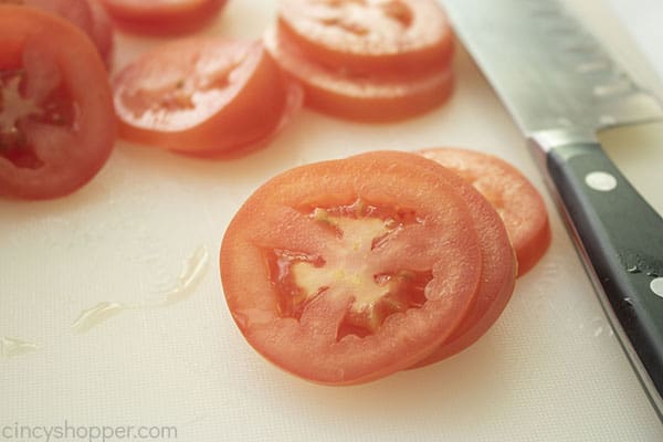 How to make Caprese Salad, sliced tomatoes.