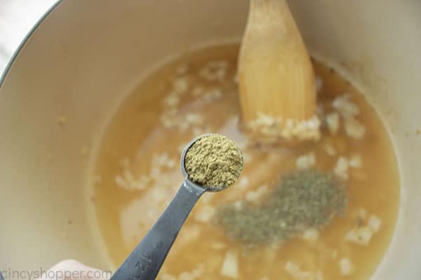 Adding poultry seasonings to broth mixture