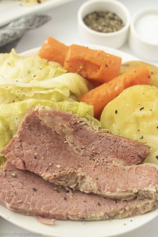 Corned Beef and Cabbage with potatoes and carrots on a plate.