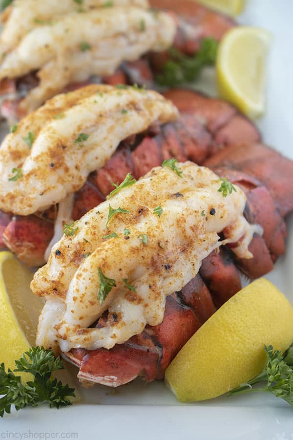 Baked Lobster Tail with butter on a platter