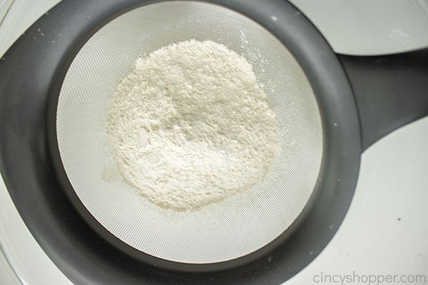 Sifting the quick bread dry ingredients