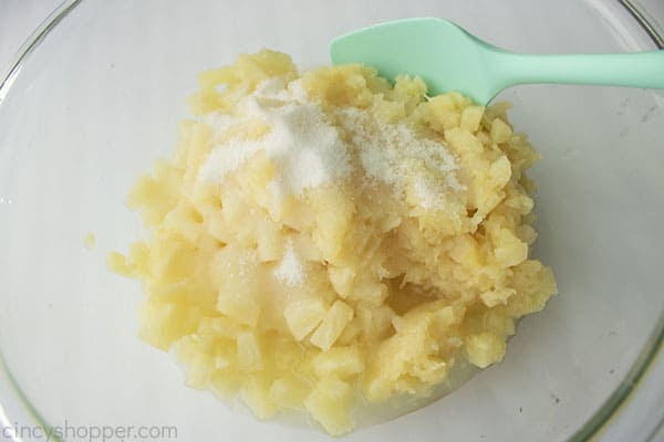 Pineapple and sugar in bowl
