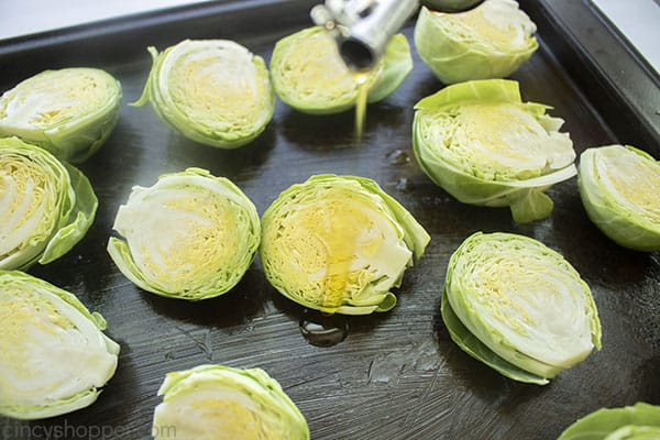 Olive oil drizzling on Brussel Sprouts