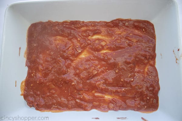 Sauce added to bottom of baking dish