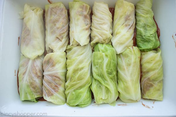 Filling added to cabbage and rolled in a baking dish