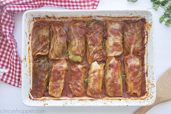 Baked cabbage rolls in a white baking dish