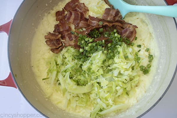 Bacon, cabbage and green onions added to potatoes