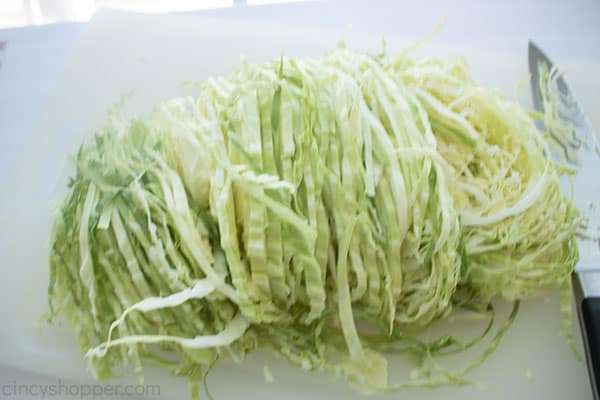 Shredded cabbage on a cutting board
