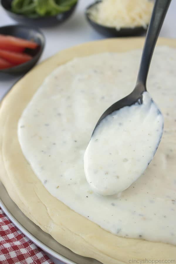 White Pizza Sauce on a spoon