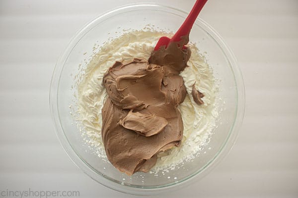 Chocolate mixture added to whipped cream